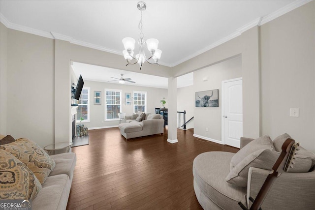 living room featuring dark wood-type flooring, baseboards, and ornamental molding