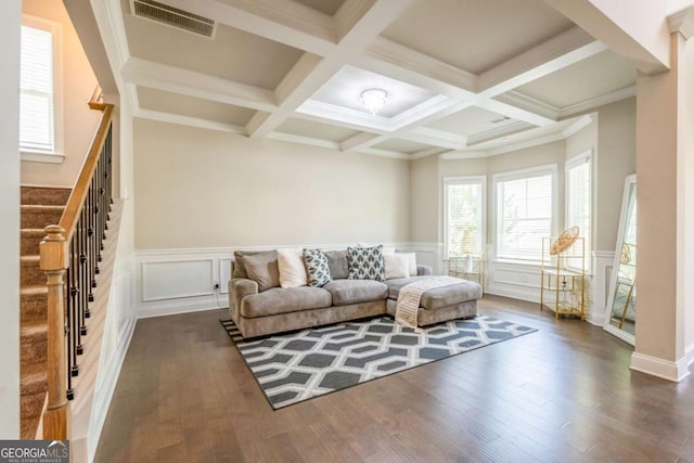 living room with beam ceiling, visible vents, dark wood finished floors, and stairs