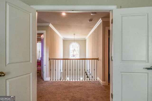 hall with carpet and crown molding