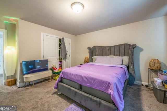 bedroom with carpet flooring and baseboards