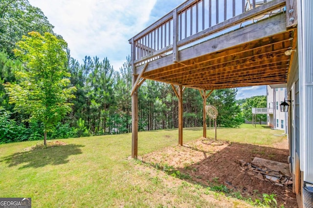 view of yard featuring a wooden deck