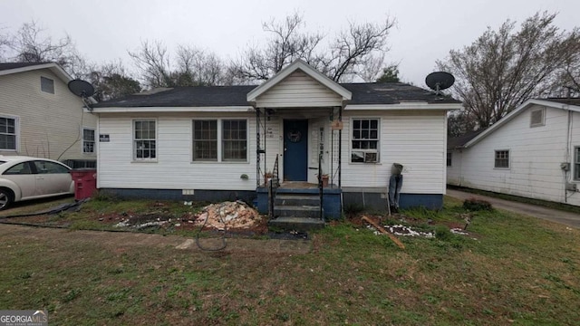 bungalow with a front yard