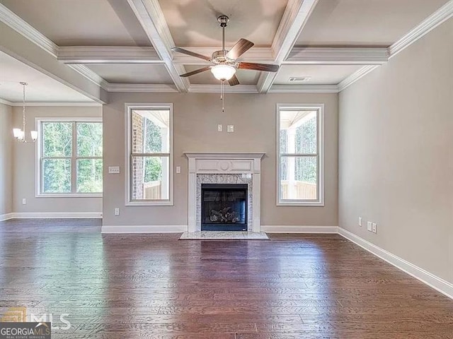 unfurnished living room with baseboards, coffered ceiling, dark wood-style floors, beam ceiling, and a high end fireplace