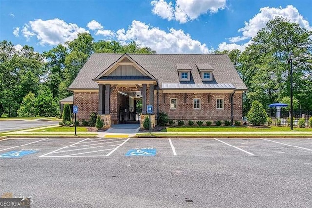 view of property with uncovered parking and fence