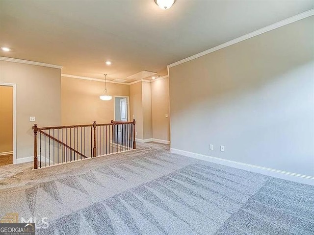 carpeted spare room with recessed lighting, baseboards, and ornamental molding