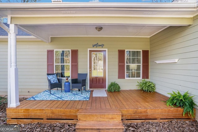 doorway to property featuring covered porch