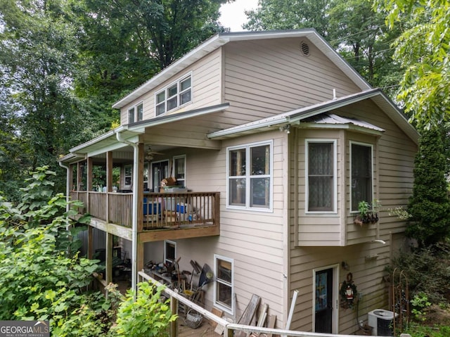 view of side of home featuring central AC unit