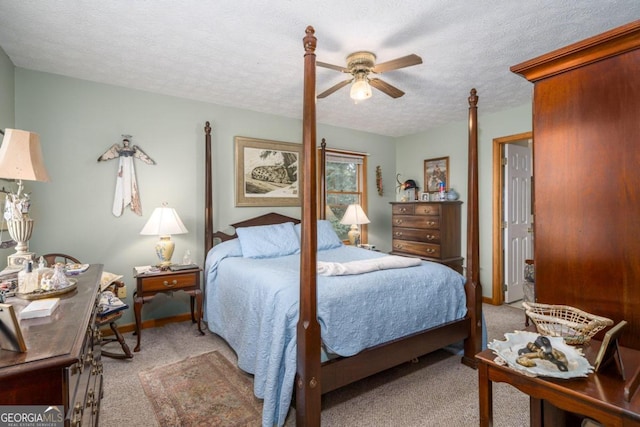 bedroom with light carpet, a ceiling fan, baseboards, and a textured ceiling