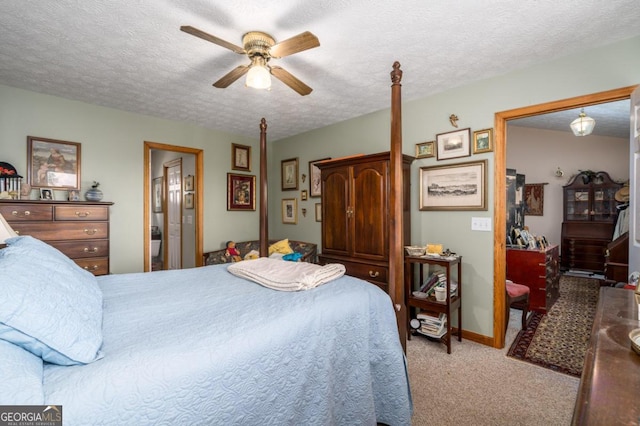 bedroom with a textured ceiling, baseboards, a ceiling fan, and light colored carpet