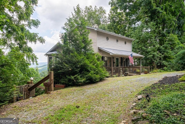 back of house with covered porch