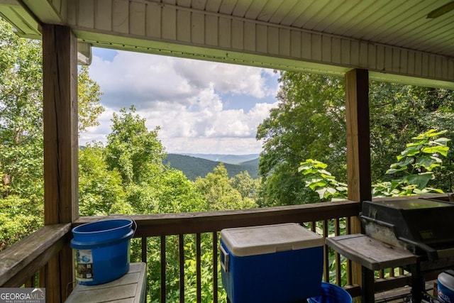 wooden terrace with a mountain view