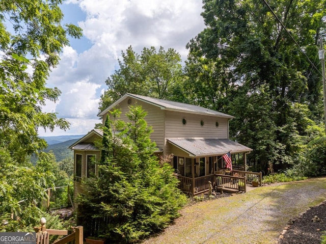 exterior space with metal roof and a porch