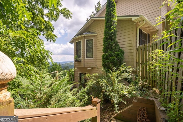 view of side of property with fence