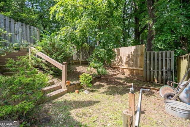 view of yard with a fenced backyard