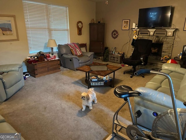 living room with light carpet and a fireplace