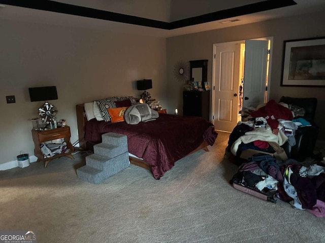 bedroom featuring carpet floors and visible vents