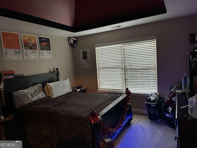 carpeted bedroom with visible vents