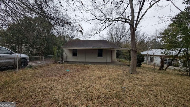 view of outbuilding featuring fence