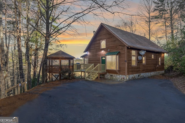 rustic home with crawl space and a gazebo