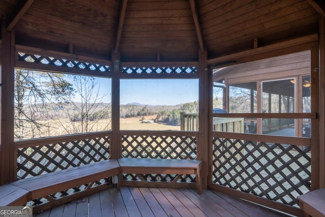 wooden deck featuring a gazebo and a mountain view