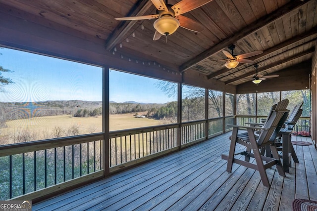 wooden terrace with a ceiling fan and a rural view