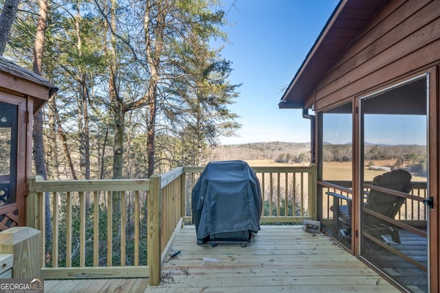 deck featuring a grill