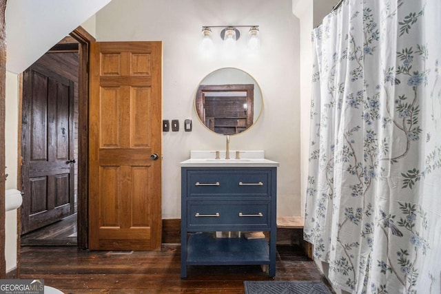 bathroom featuring wood finished floors, vanity, and a shower with curtain