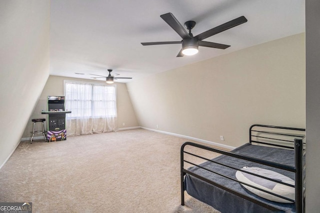 carpeted bedroom with lofted ceiling, ceiling fan, and baseboards