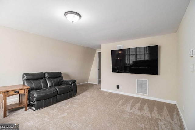 living room with visible vents, light carpet, and baseboards