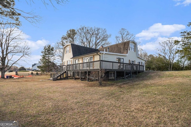 view of side of property featuring stairs, a deck, a lawn, and a gambrel roof