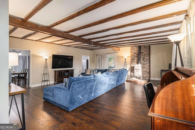 living room with baseboards, dark wood-style flooring, and beamed ceiling