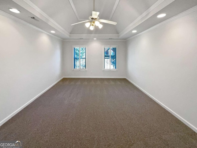 carpeted empty room featuring ceiling fan, recessed lighting, baseboards, ornamental molding, and a tray ceiling