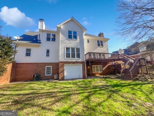 back of house with stairs, a chimney, a deck, and brick siding