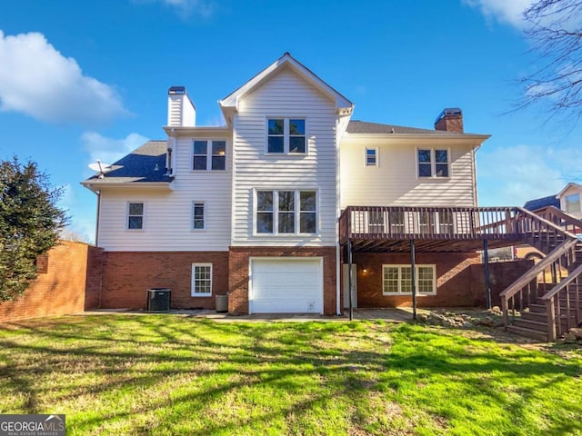 back of house with a deck, brick siding, a chimney, and stairs