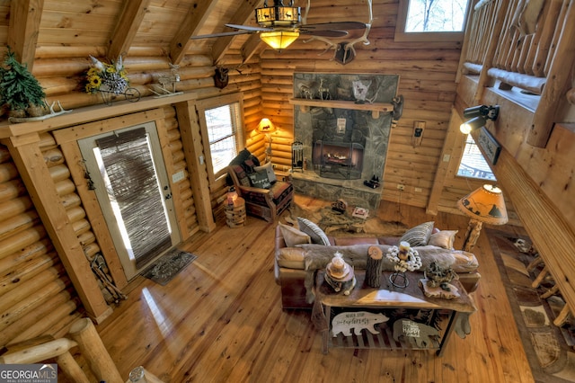 381 Morley Ct, Ellijay, GA 30540 - living room with ceiling fan, log walls, wood-type flooring, wooden ceiling, and a fireplace