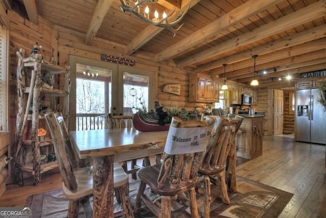 381 Morley Ct, Ellijay, GA 30540 - dining space featuring a chandelier, french doors, light wood finished floors, a wood ceiling with exposed beams, and log walls