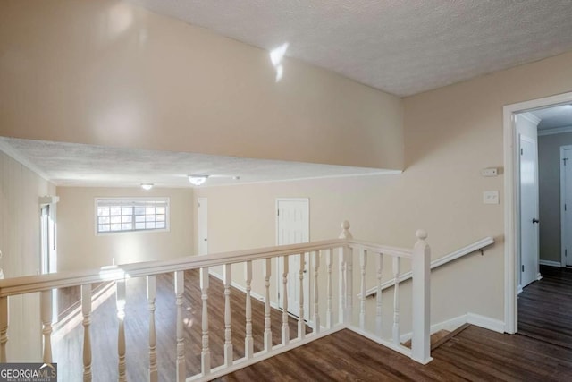 2236 Chestnut Hill Cir, Decatur, GA 30032 - corridor featuring a textured ceiling, baseboards, dark wood-type flooring, and an upstairs landing