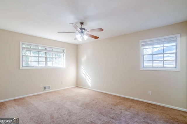 2236 Chestnut Hill Cir, Decatur, GA 30032 - empty room featuring baseboards, visible vents, ceiling fan, and light colored carpet