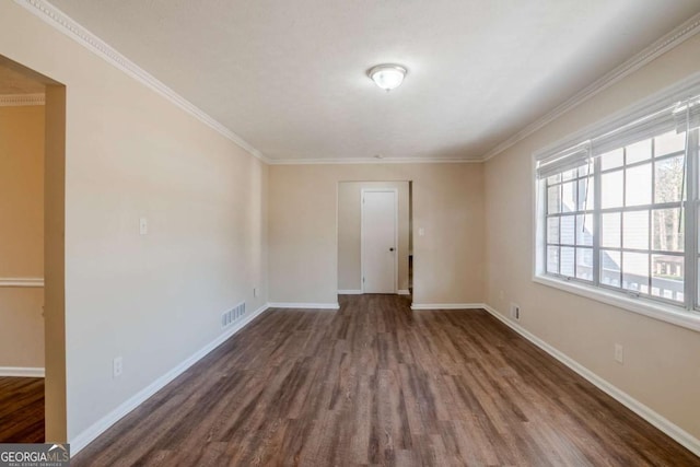 2236 Chestnut Hill Cir, Decatur, GA 30032 - unfurnished room featuring ornamental molding, visible vents, dark wood finished floors, and baseboards