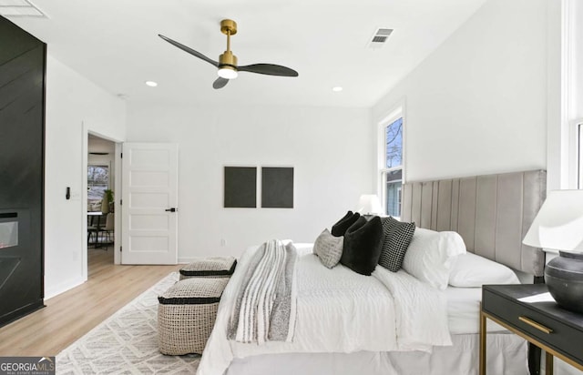 bedroom featuring light wood-style floors, visible vents, and recessed lighting