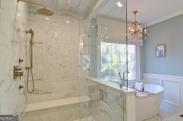 full bathroom featuring a freestanding tub, ornamental molding, wainscoting, a decorative wall, and marble finish floor