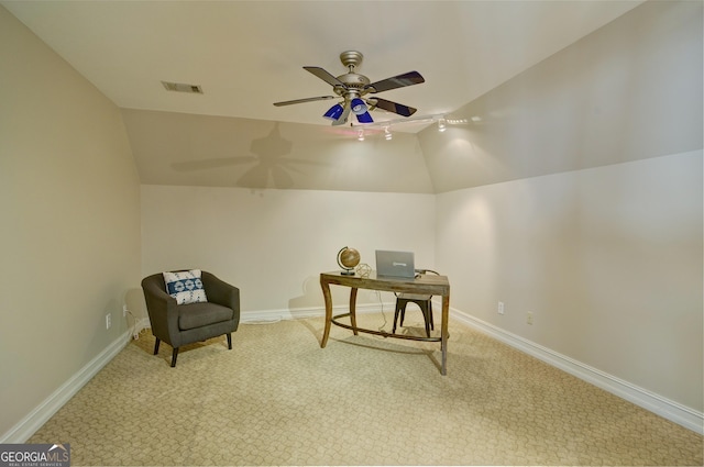 living area featuring visible vents, lofted ceiling, carpet floors, baseboards, and ceiling fan