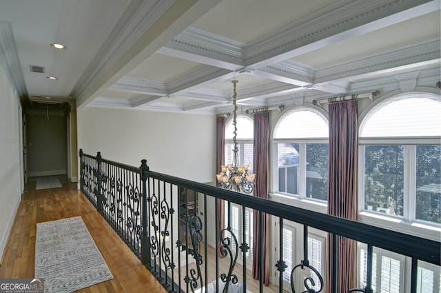 hallway featuring beamed ceiling, wood finished floors, visible vents, and coffered ceiling