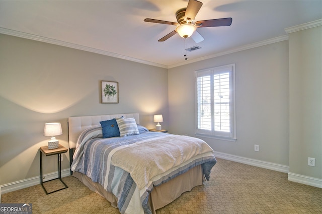 carpeted bedroom featuring visible vents, baseboards, ornamental molding, and a ceiling fan