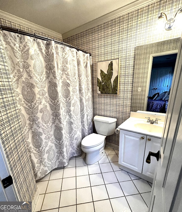 bathroom featuring vanity, wallpapered walls, crown molding, tile patterned floors, and toilet