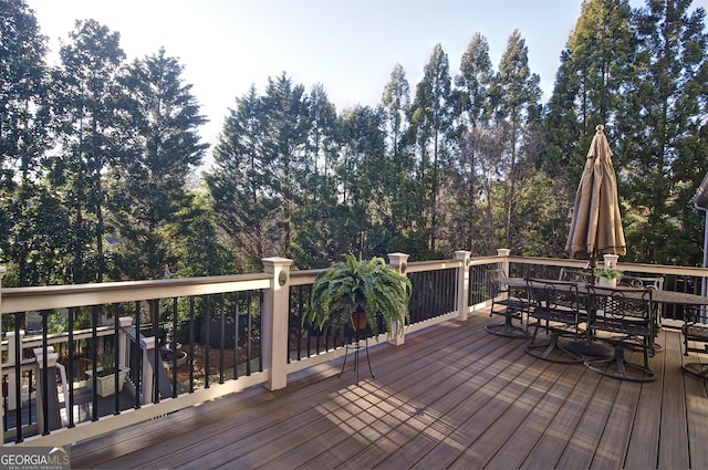 wooden deck featuring outdoor dining space