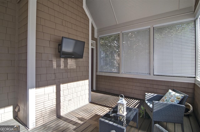 sunroom with lofted ceiling