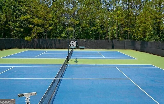 view of sport court with community basketball court and fence