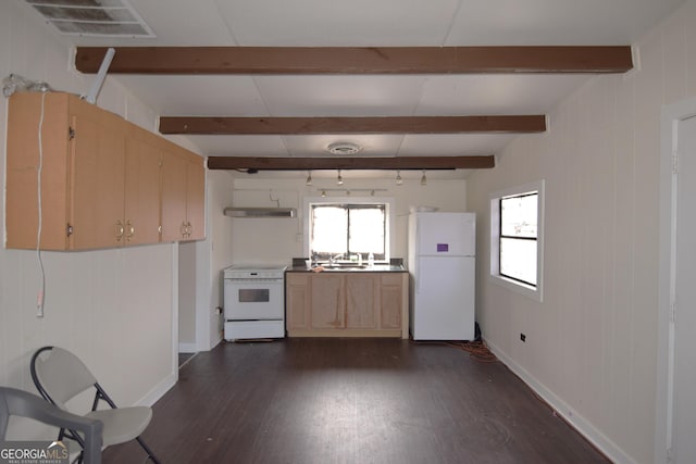 kitchen with white appliances, plenty of natural light, a sink, and beam ceiling