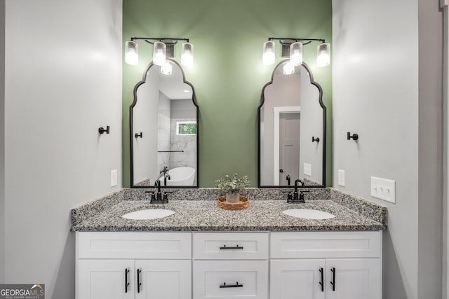 full bathroom with double vanity and a sink